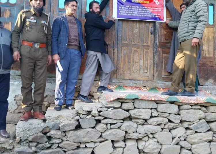 Police Attaches House Of Absconding Accused Evading Law For 7 years in Kupwara